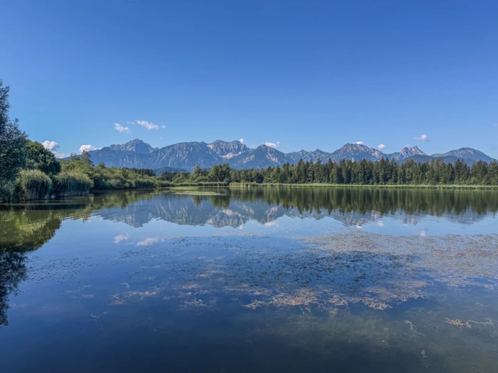 Still lake reflecting the Bavarian Alps near Füssen